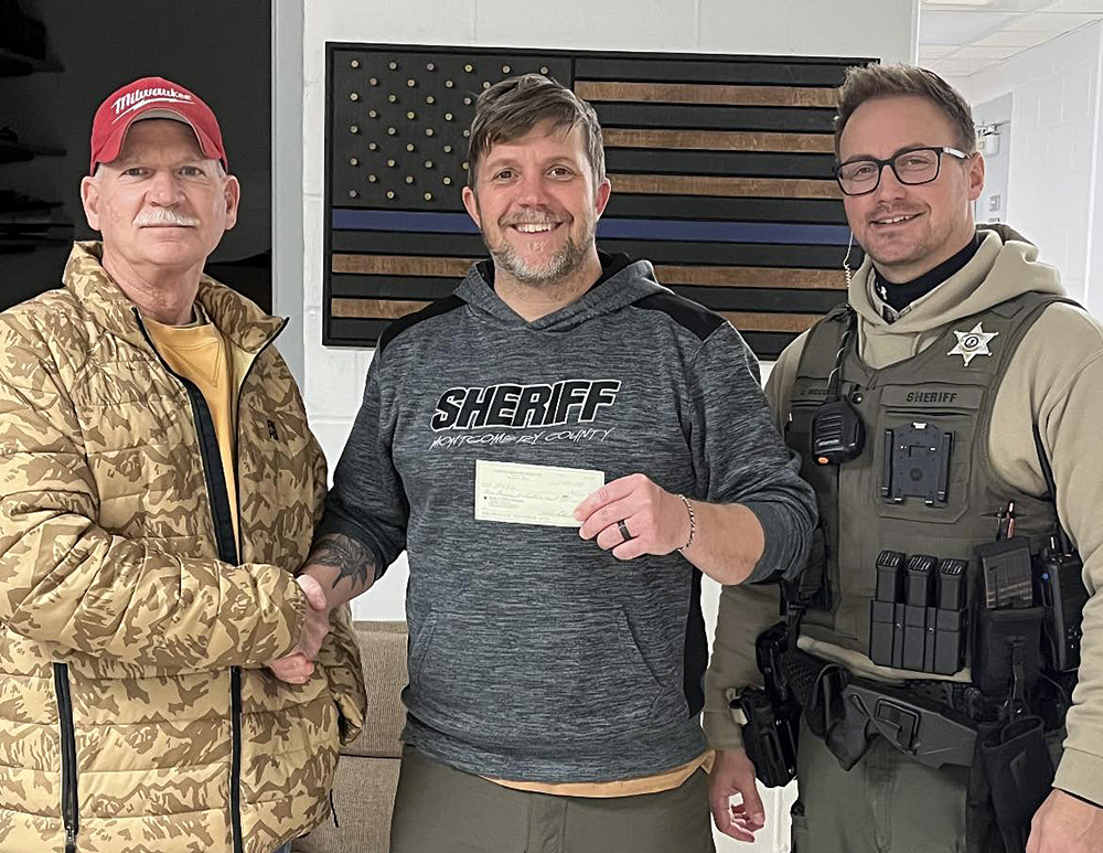 On behalf of the Cahokia Creek Dirt Riders, Steve Pickerill presented Sheriff Holshouser with a donation to the Montgomery County Sheriff's Office. The funds will be used in support of operations at the Sheriff's Office.